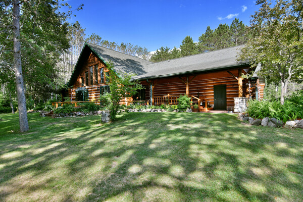 custom log home nestled on 23 wooded acres